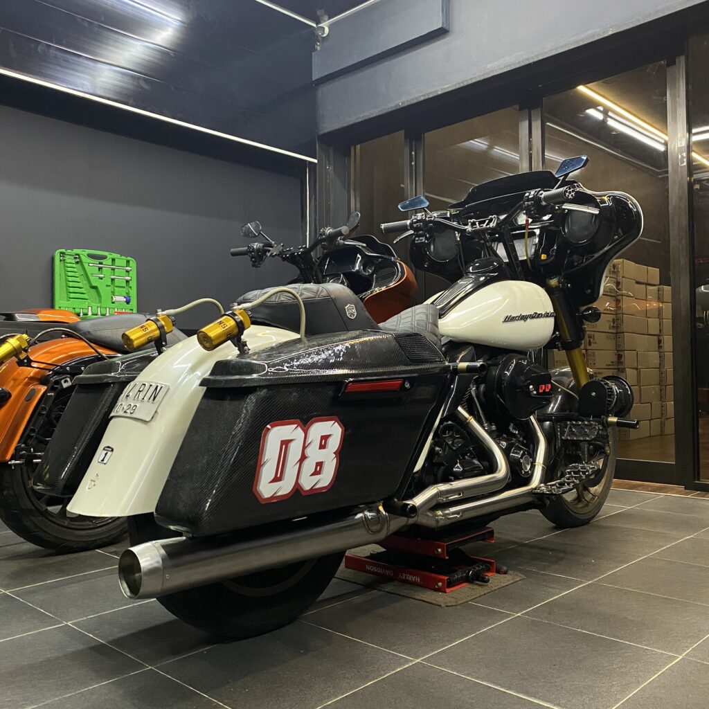 Harley Road Glide M8 motorcycle with a "Big Long Smoke" muffler.