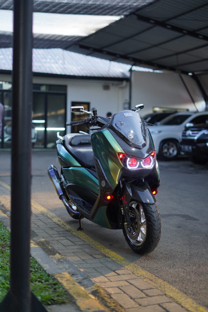 Nmax motorcycle with a smoke muffler exhaust