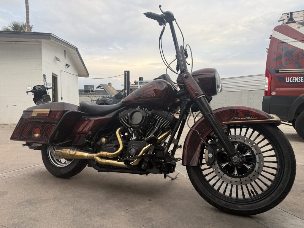 Harley-Davidson Touring Twin Cam 88 motorcycle with Big Shot Gold exhaust.